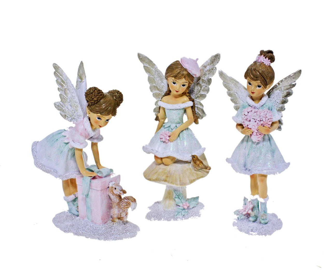 Set of three fairy figurines in pastel colours with garden, animal and gift details