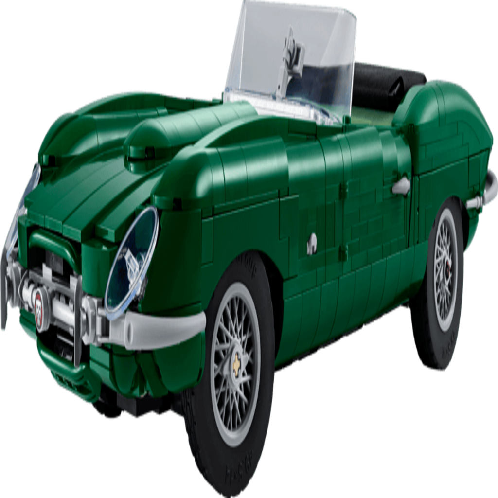 LEGO Jaguar E-Type 11381 model car displayed under warm lighting on a dark tabletop