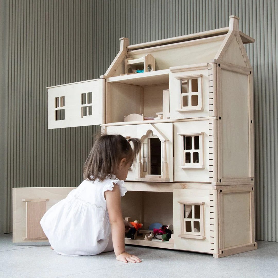 PlanToys wooden dollhouse basement extension with staircase, windows and natural wood finish for imaginative pretend play.