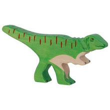 Green dinosaur toy figure on a white background