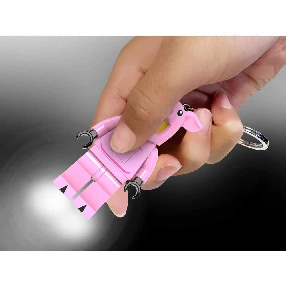 LED lights shining from the feet of the LEGO Piggy Girl keychain
