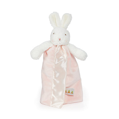 A white plush bunny comforter with long ears and a soft pink satin blanket, photographed on a clean white background.