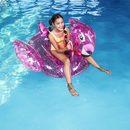 Swim Essentials Neon Pink Flamingo inflatable ride on measuring 150cm with sturdy grab handles for pool and beach adventures
