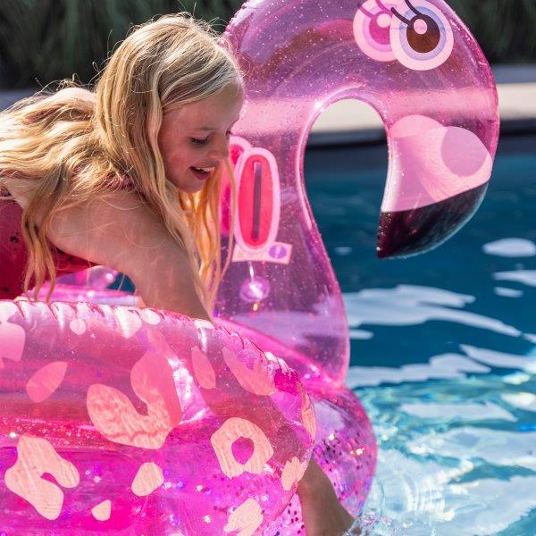 Swim Essentials Neon Pink Flamingo inflatable ride on measuring 150cm with sturdy grab handles for pool and beach adventures