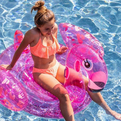 Swim Essentials Neon Pink Flamingo inflatable ride on measuring 150cm with sturdy grab handles for pool and beach adventures