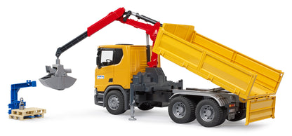 Bruder Scania Super 560R construction truck with rotating crane, tipping tray and two pallets in 1:16 scale