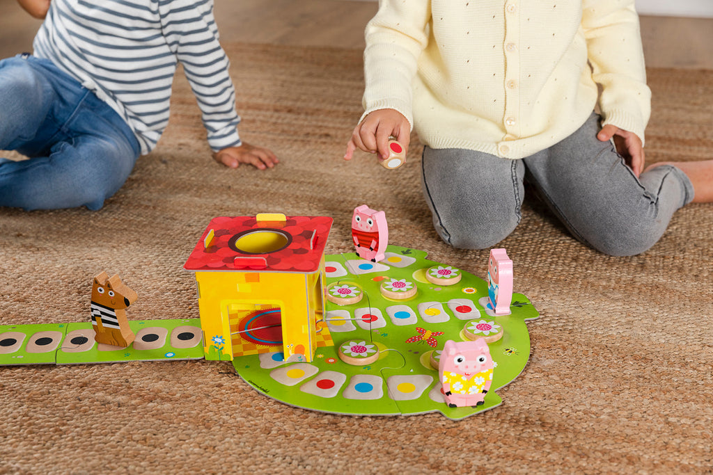 Full contents of the Goula 3 Little Pigs board game unpacked and arranged together