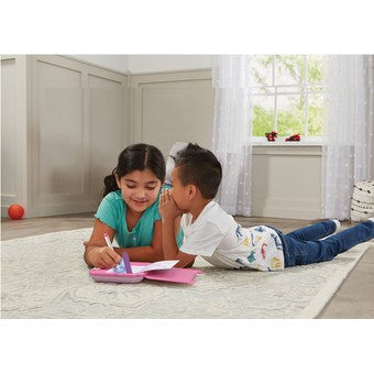 children writing in Vtech notebook