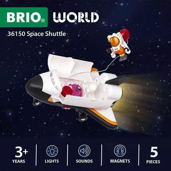 Child playing with the BRIO space shuttle toy on the floor as part of a BRIO World space railway layout