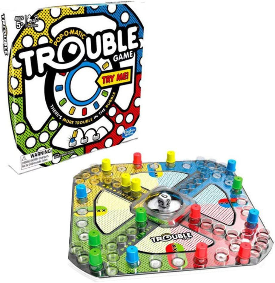 Trouble game board with Pop-O-Matic bubble and coloured playing pegs