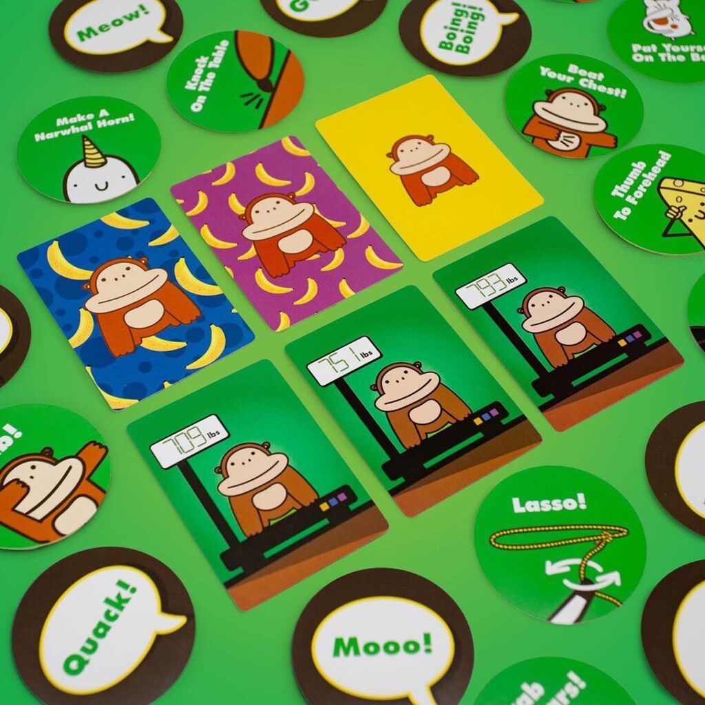 800 Pound Gorilla game components including gorilla cards, wooden coconuts, foam bananas and spinner