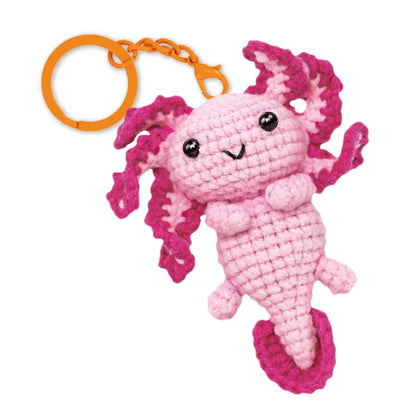 Close-up of the Love Axolotl crochet keychain showing its adorable aquatic character details