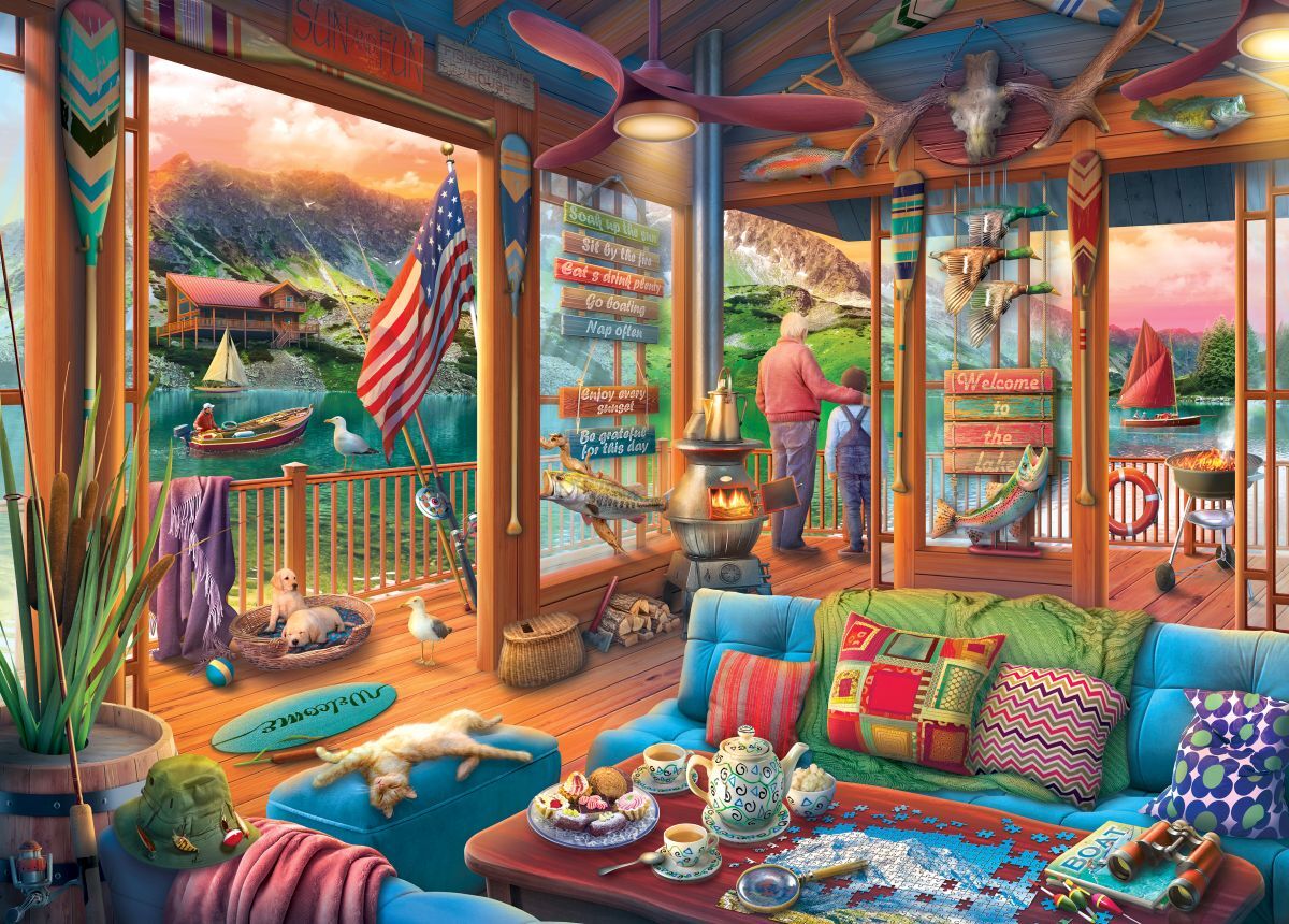 Colorful living room with a view of a lake and mountains, featuring a couch, coffee table, and decorative elements.