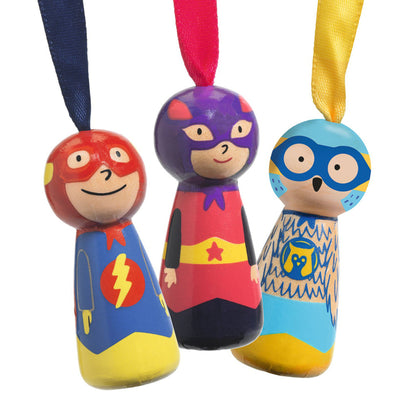 Djeco Flying Heroes parachute figures in flight, their canopies opening as they drift back to the ground outdoors