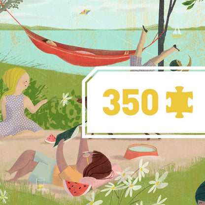 completed Djeco A Summer's Day puzzle showing a detailed lakeside illustration filled with colourful summer scenery