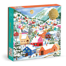 Jigsaw puzzle box with a winter village scene on a white background