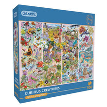 Gibson 500-piece jigsaw puzzle box titled 'Curious Creatures' by Janice Daughters, featuring a colorful collage of various animals on the front and a blue branded box design.