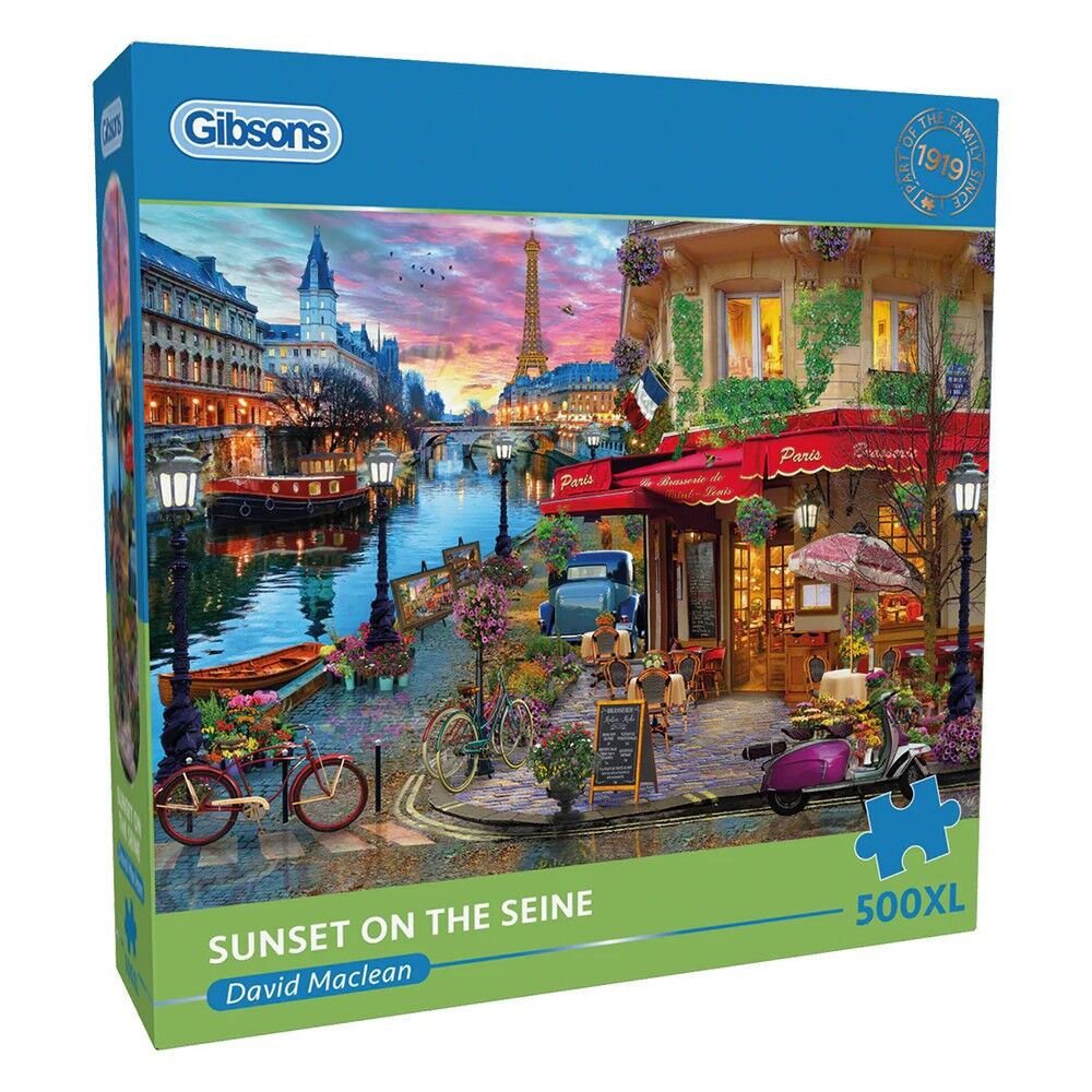 Gibsons puzzle box titled 'Sunset on the Seine' by David Maclean with a scenic Parisian street and Eiffel Tower.