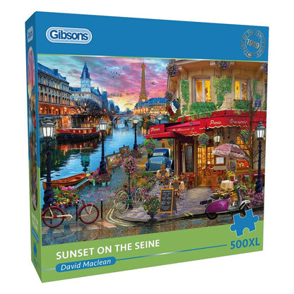 Gibsons puzzle box titled 'Sunset on the Seine' by David Maclean with a scenic Parisian street and Eiffel Tower.