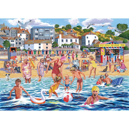 A colorful beach scene illustration showing people swimming, playing, and walking on the sand with houses, trees, and a seaside food stall in the background.