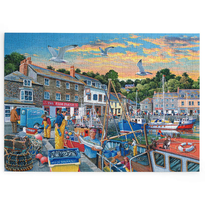 Completed House of Puzzles Catch of the Day 1000-piece jigsaw showing fishermen, fishing boats, harbour buildings and seagulls.