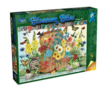 Jigsaw puzzle box titled 'Blossom Bliss' with floral and butterfly design on a white background