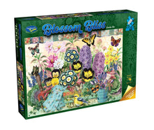 Jigsaw puzzle box titled 'Blossom Bliss' with colorful flowers and butterflies on a white background.