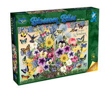 Jigsaw puzzle box with floral and butterfly design on a white background