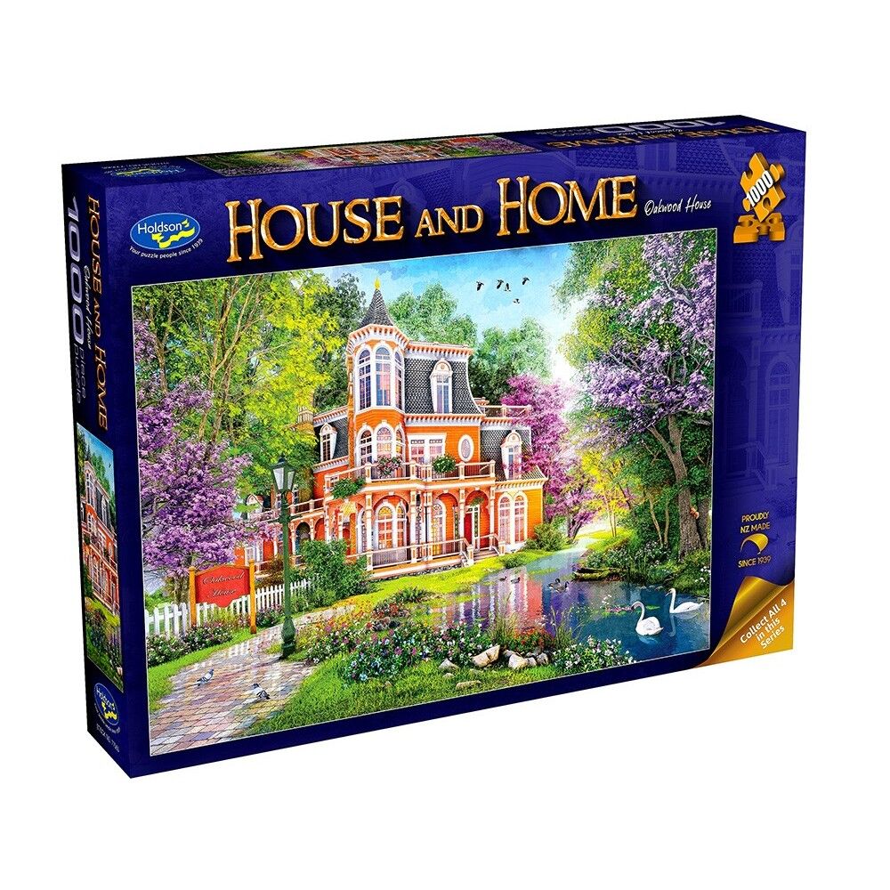 Jigsaw puzzle box featuring a scenic house with trees and water, branded 'House and Home'.