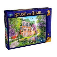 Jigsaw puzzle box featuring a scenic house with trees and water, branded 'House and Home'.