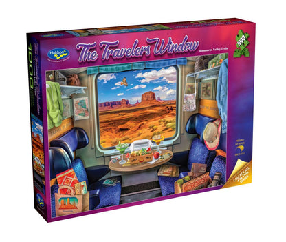 Jigsaw puzzle box titled 'The Traveler's Window' with a train scene and desert landscape on the cover.