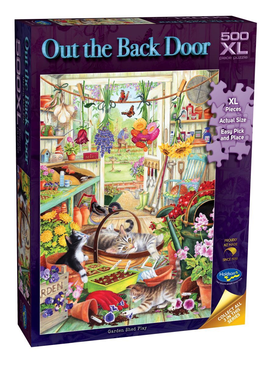 Jigsaw puzzle box titled 'Out the Back Door' with a colorful garden scene on the cover.
