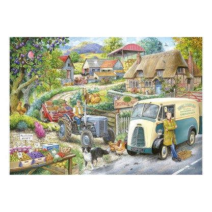 A colorful illustrated Puzzle scene showing a rural farm road with a cream and blue delivery van parked beside a woman standing by the door, a tractor with a farmer seated inside, chickens, a dog, fruit stands, and thatched cottages in the background.