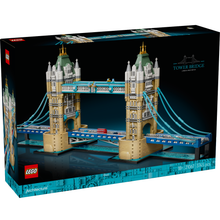LEGO Architecture Tower Bridge set in its original retail box, featuring a detailed model of London's Tower Bridge with blue cables, beige stone towers, and green roofs against a dark background.