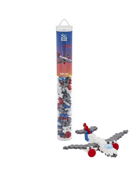 Plus-Plus Airplane 100 piece building tube standing upright against a plain white background