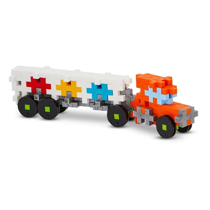 Finished Plus-Plus truck with cab and trailer built from 100 interlocking basic pieces