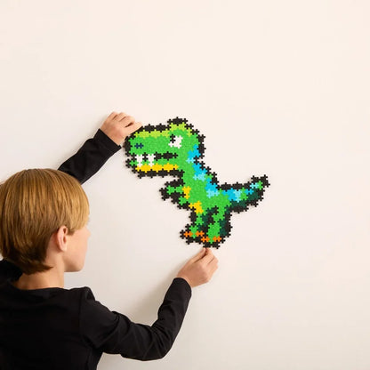 The same Plus-Plus T-Rex assembled as a standing three-dimensional dinosaur figure