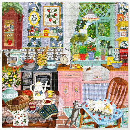 Completed jigsaw puzzle featuring a colourful country kitchen with pink cupboards, floral wallpaper, strawberry decorations, vintage stove, fresh bread, flowers and two cats beside a dining table.
