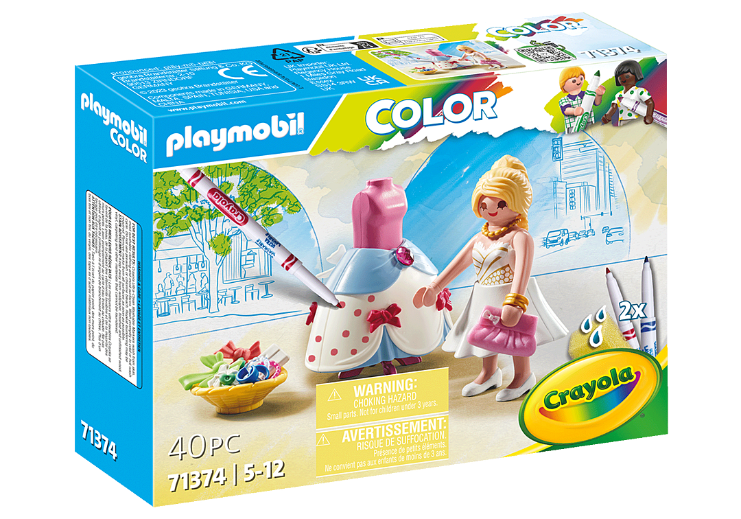 Playmobil Color 71374 Barbie dressmaker set box, featuring a blonde female figure in a white dress with a pink purse, a pink and blue dress form, paintbrushes, and a bowl of colorful paint tubes on the front of the retail packaging.