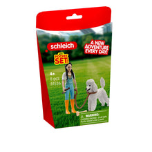 Schleich pocket set packaging with a girl and dog on a grassy field