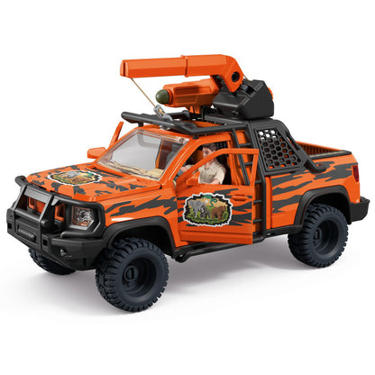 Schleich Orange and black toy pickup truck with a crane on top, with a male figure visible inside the driver's seat.