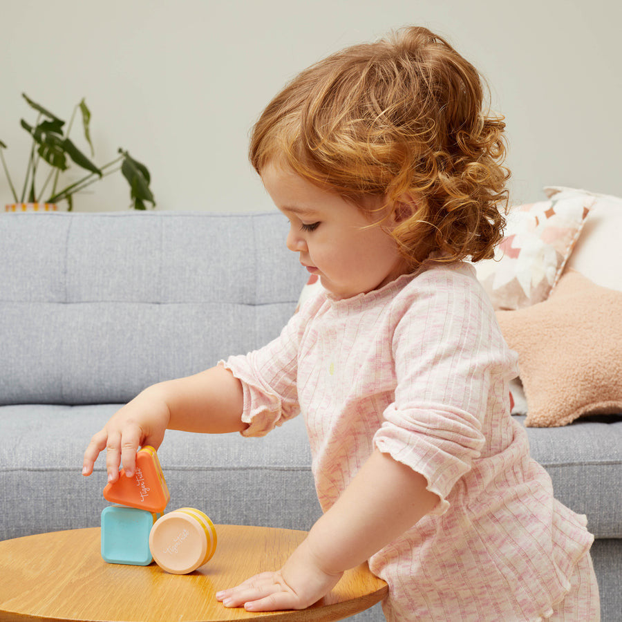 girl playing with shape shakers