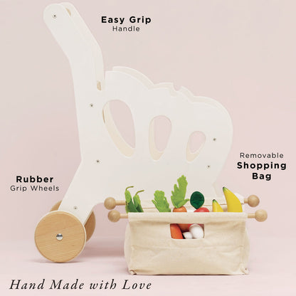 Child's shopping cart with removable bag and easy grip handle on a pink background