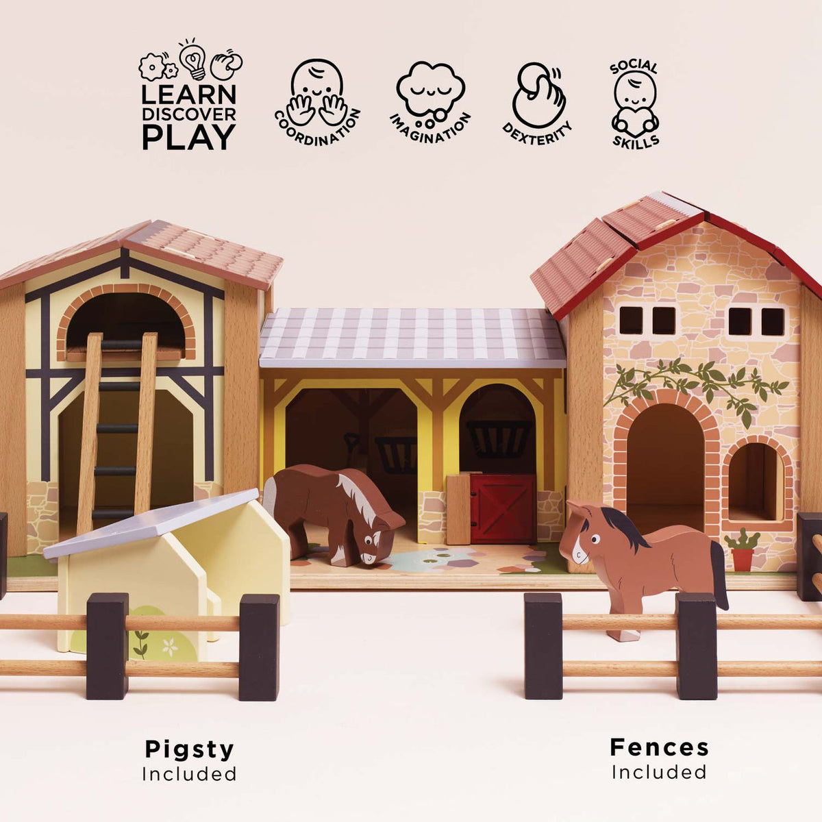 Front view of Le Toy Van Wooden Farmyard Set featuring the included pigsty, movable wooden fences, two horses, stable buildings and hay loft ladder, encouraging imaginative farm play.