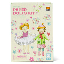 Vintage paper dolls kit packaging with two dolls on a floral background