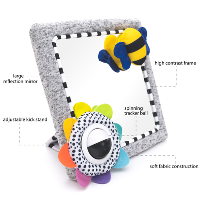 Baby tummy time activity mirror with labelled features including large reflection mirror, high contrast frame, spinning tracker ball, adjustable kickstand and soft fabric construction.