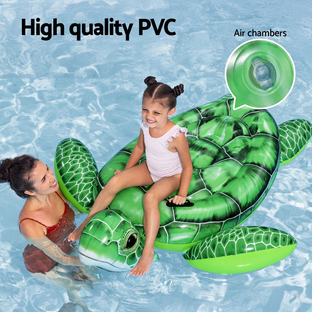 Green inflatable turtle pool float with a child and adult in water, highlighting high-quality PVC and air chambers.