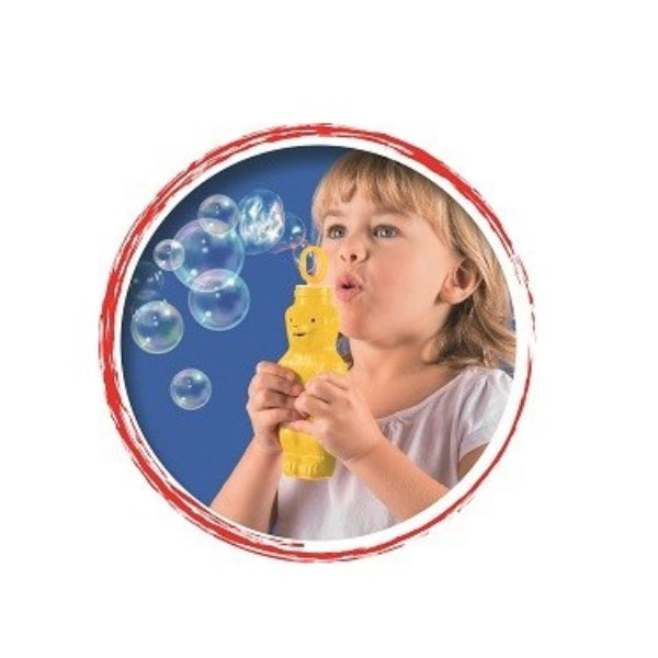 Child blowing bubbles with a yellow bubble wand on a white background