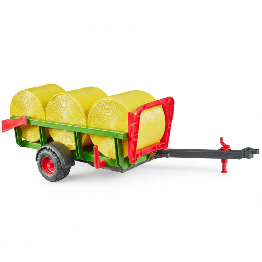 Bruder toy trailer with yellow bales of hay 