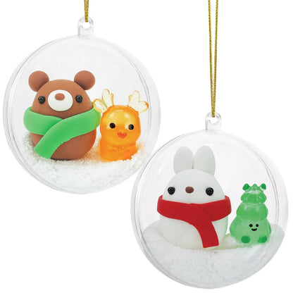 The finished bear and bunny clay ornaments hanging side by side from their cords